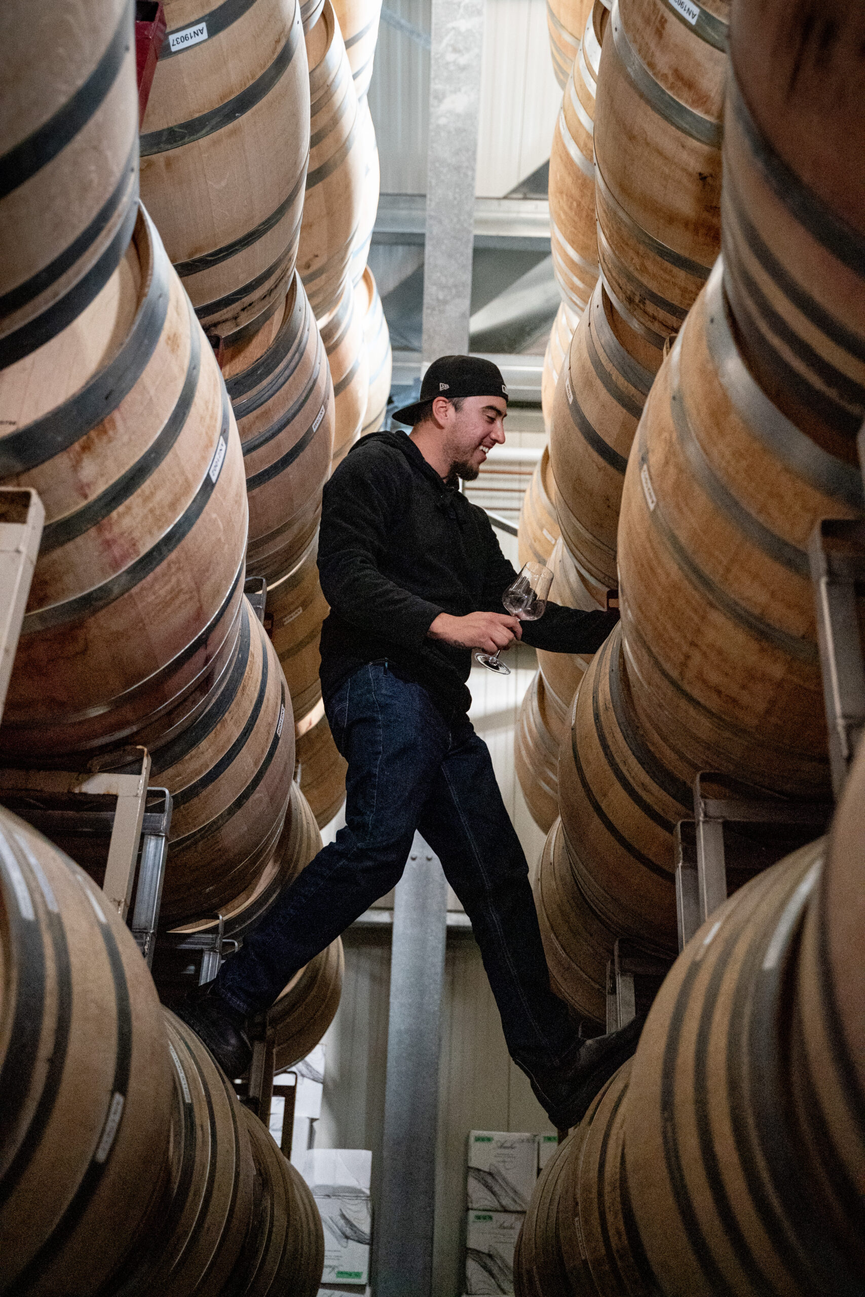 Cellarmaster, Jesse, sampling wine.