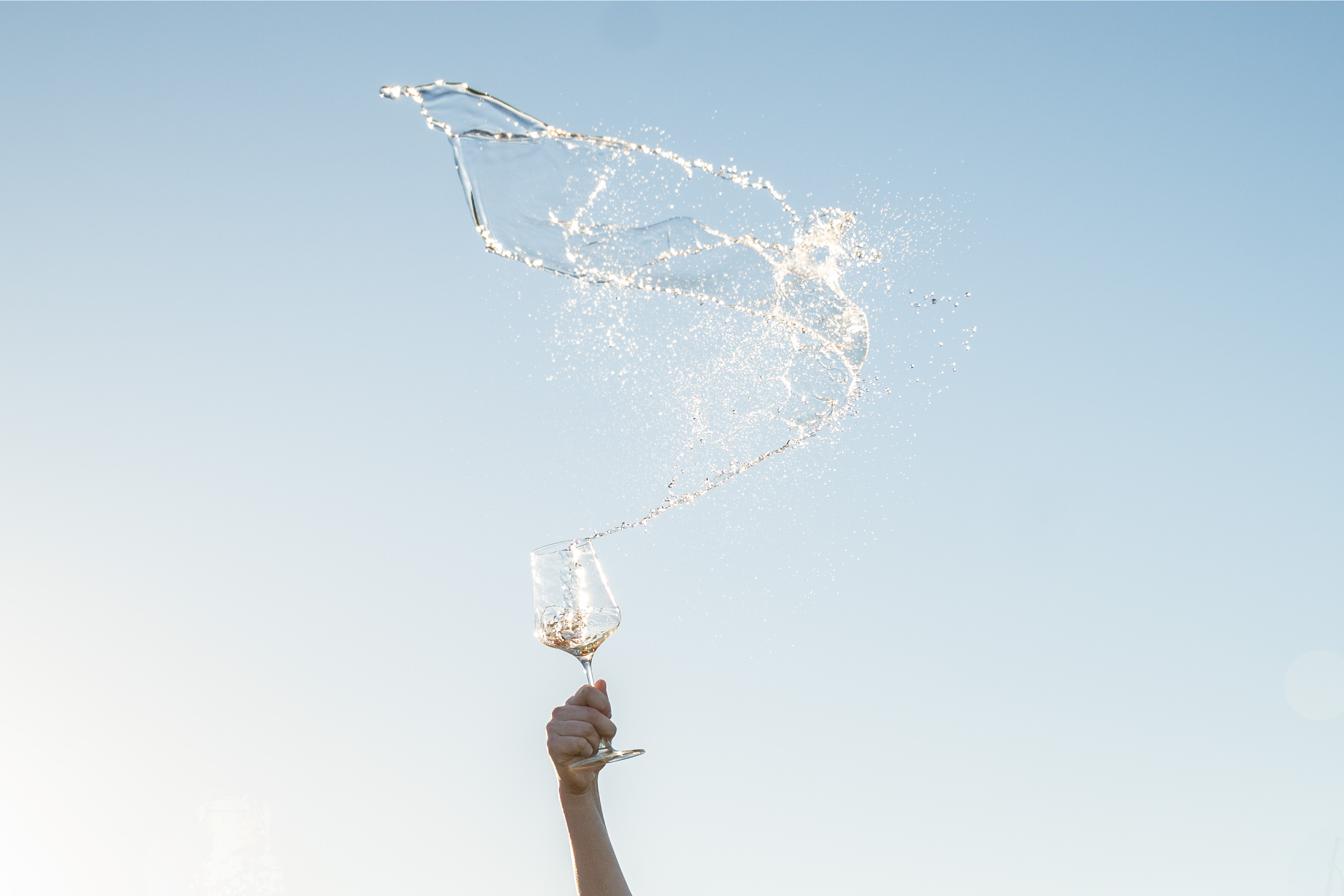 Wine being sprayed in the sky.