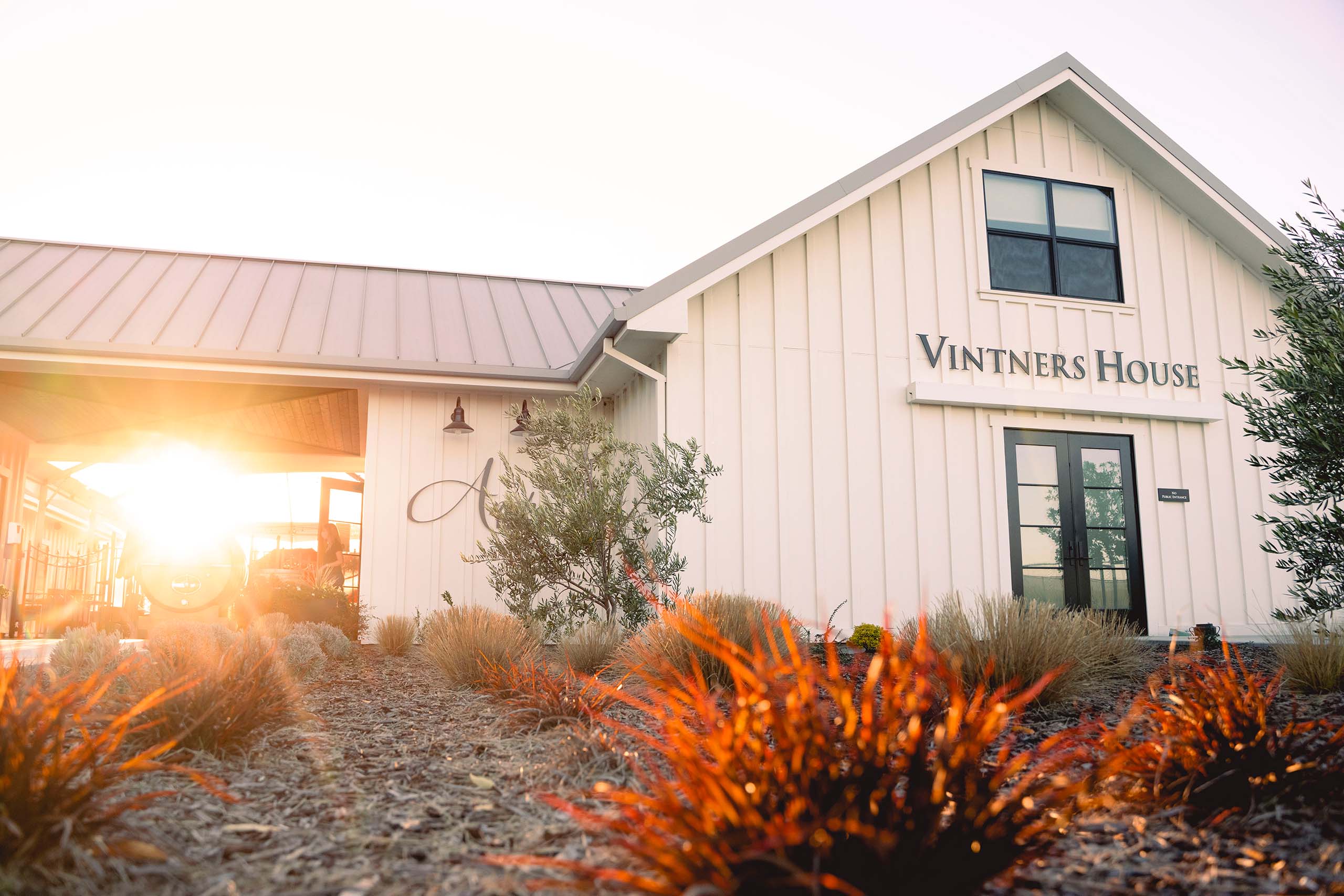 A scenic shot of the Vintners House, sunlight shining from the left. 